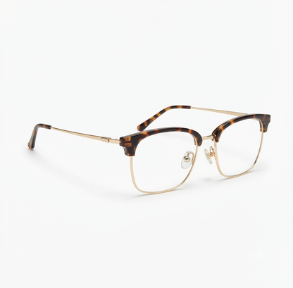 Front view of Club Masters eyeglasses with a tortoiseshell upper frame and gold metal rim.