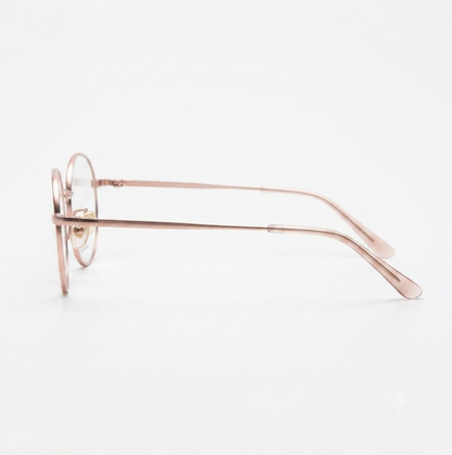 Side profile of a rose gold round optical frame highlighting its slim metal temples.